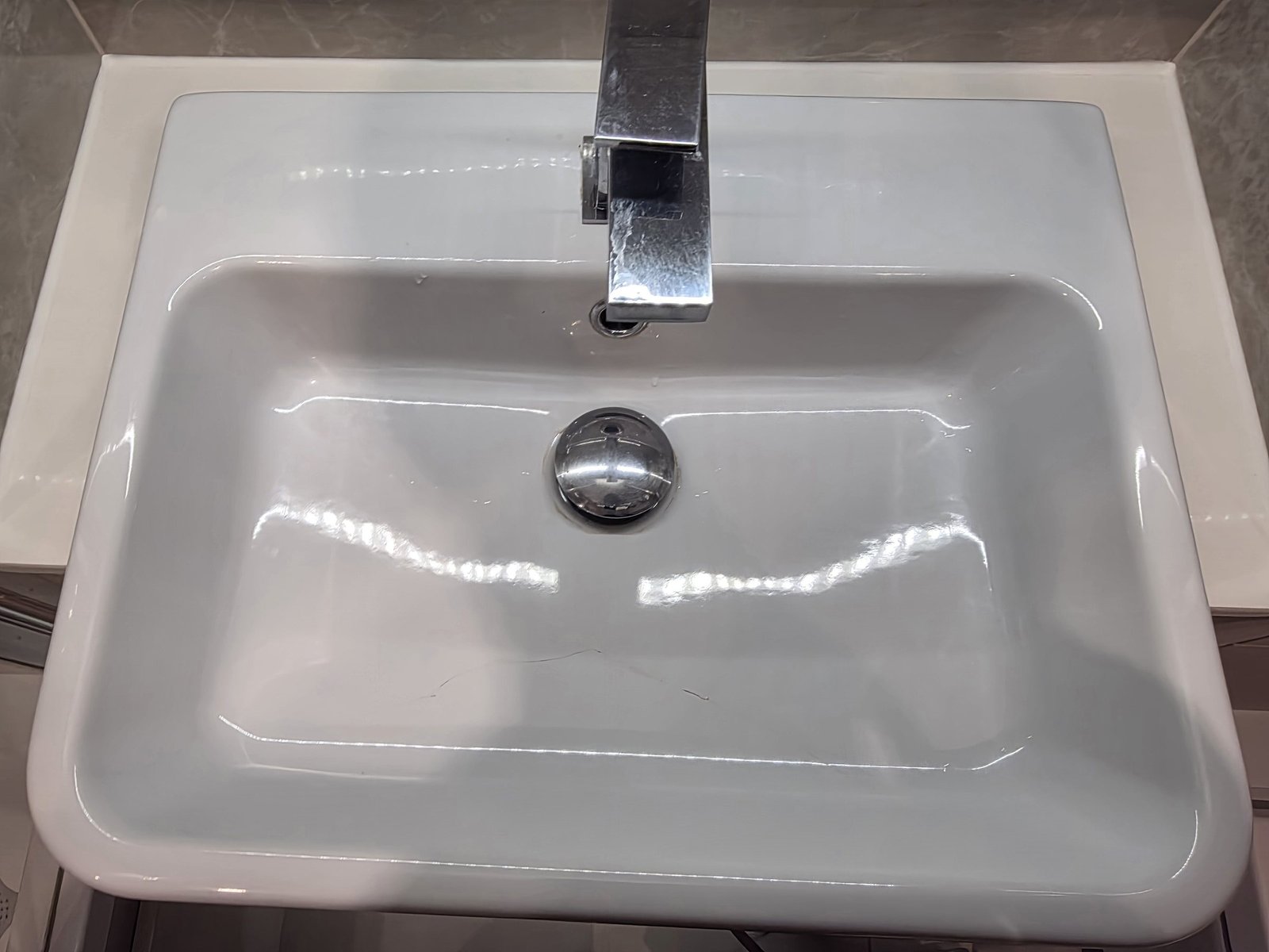 White Ceramic Washbasin Crack Repair — before restoration
